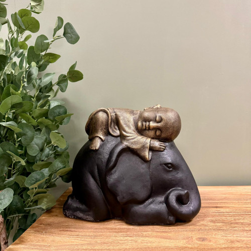 Statue Bouddha allongé sur éléphant noir